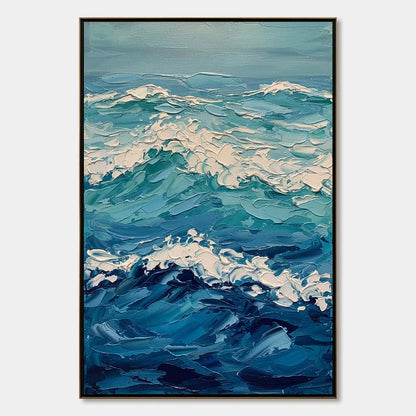 AZURE CREST: Textured Impasto Ocean Wave Wall Art | hanging in Textured impasto oil painting capturing a single cresting ocean wave in cool blue, teal, and white tones with heavy palette-knife text...