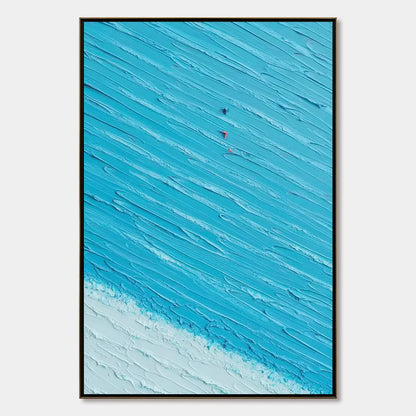 Azure Drift | Textured Abstract Beach Oil Painting Wall Art | hanging in Textured abstract beach oil painting in soft blue, sand, and white tones, evoking a serene coastal drift with thick palette-...