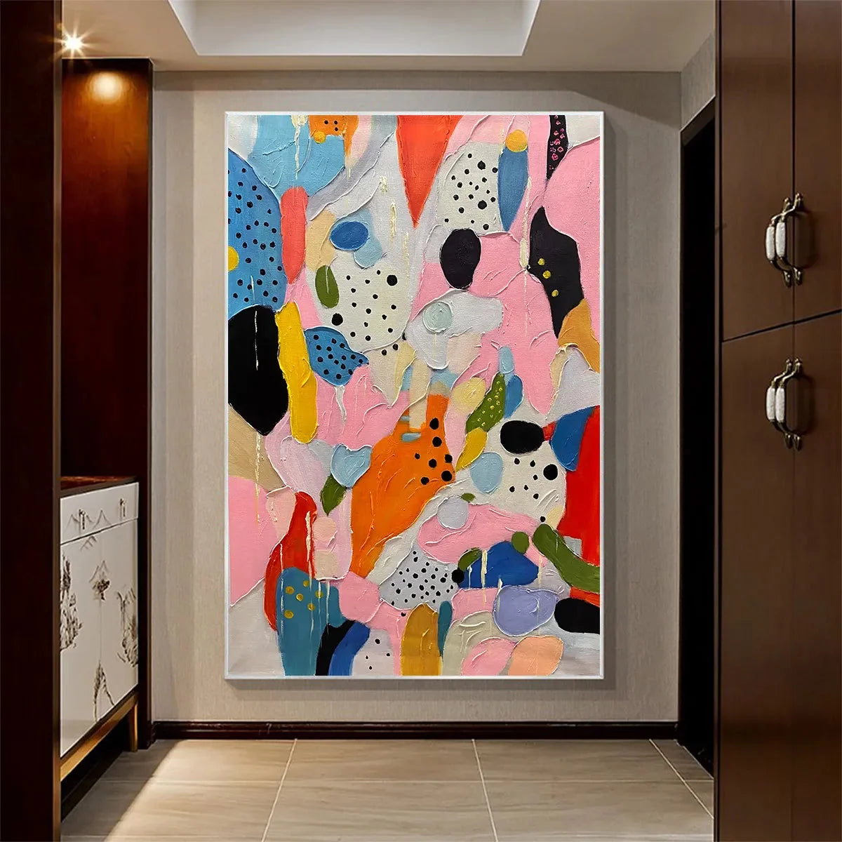 CONFETTI DREAMS: Vertical Abstract Painting in Vibrant Pink and Multicolor | black frame version on white wall